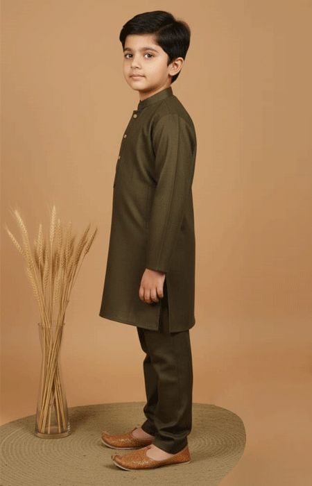 Olive Green Boys Kurta Pajama 2 Olive Green Boys Kurta Pajama Set – side view of a young boy wearing an olive green kurta pajama outfit with brown traditional shoes.