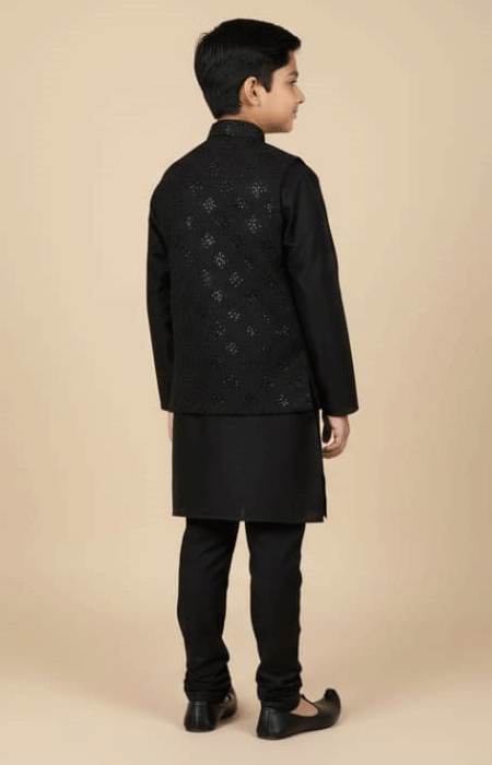 Black Embroidered Waistcoat for Boys 1 The same boy shown from the back, wearing a black kurta pajama and embroidered jacket.