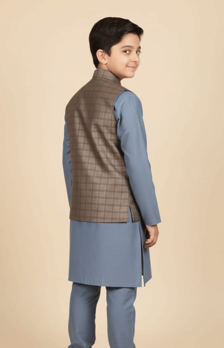 Boys Brown Checked Waist Coat 1 The same boy wearing the brown checked waistcoat, turned slightly to show the back side.