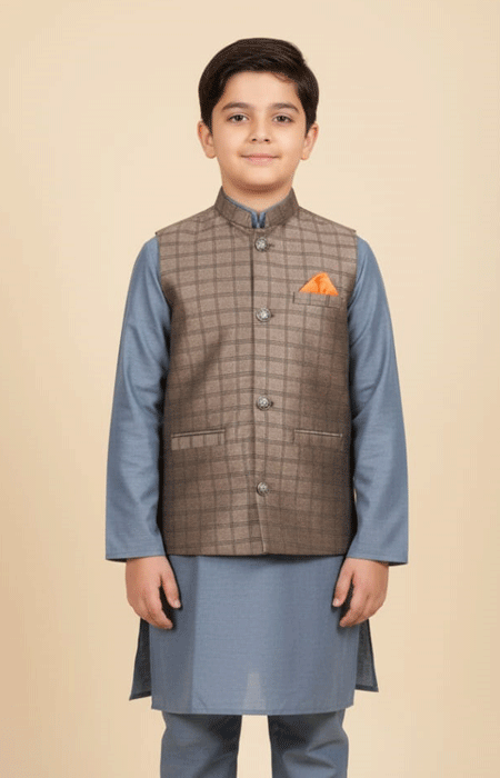 Boys Brown Checked Waist Coat A young boy wearing a brown checked waistcoat over a blue kurta pajama, standing and facing forward.