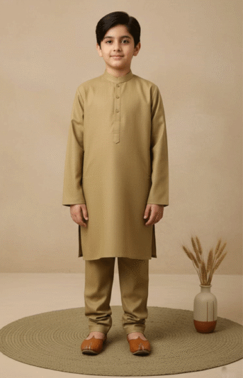 A young boy wearing a Camel Brown Kurta Pajama for Boys, standing confidently facing forward in a minimalist studio setting