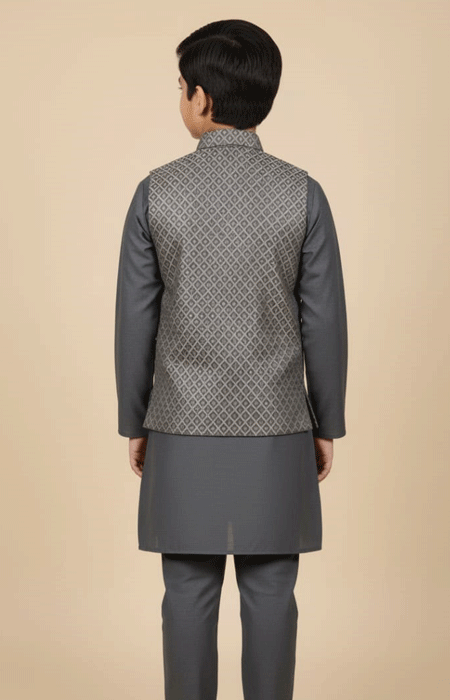 Grey Printed Waist Coat Boys 1 A boy wearing a Grey Printed Waist Coat stands facing backward, showing the full back design of his outfit.